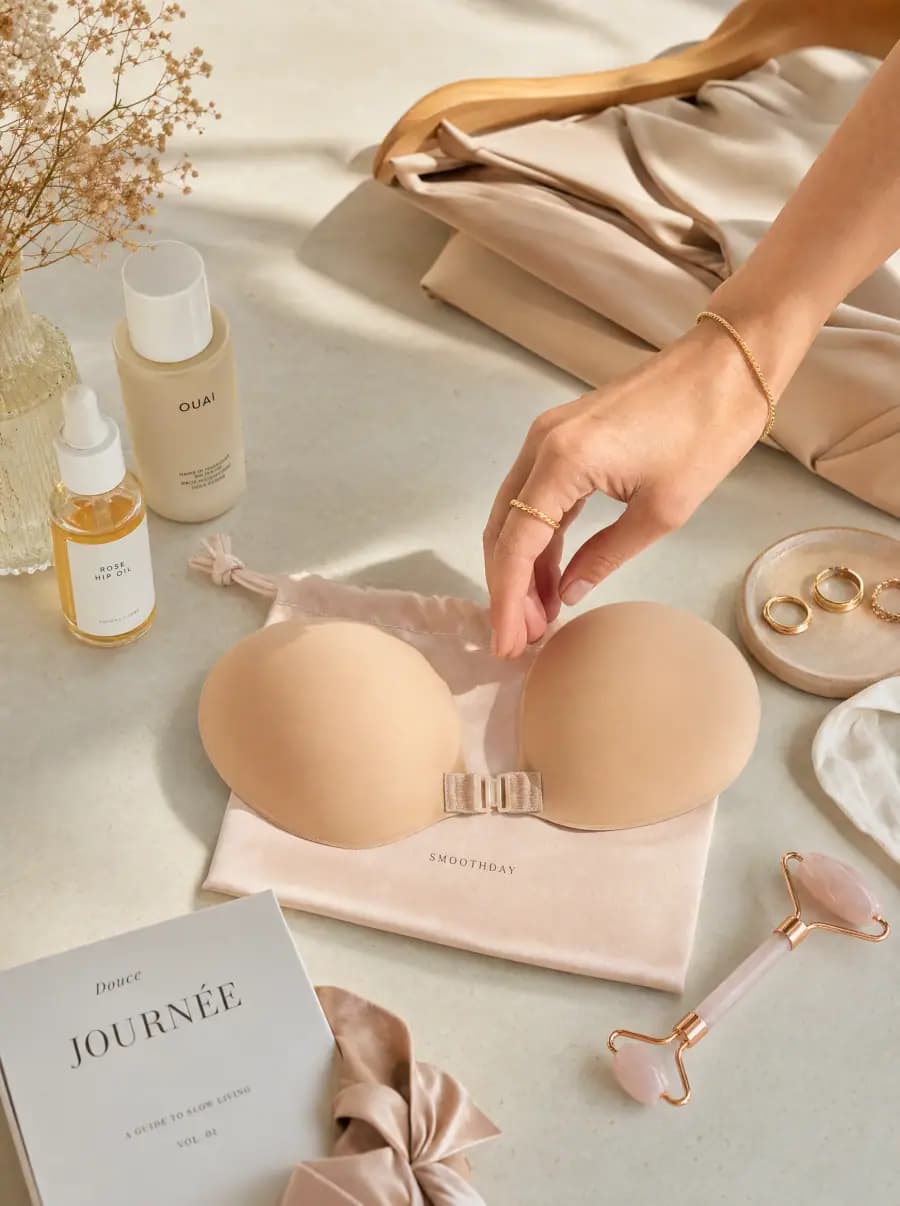 Adult model wearing a nude front-closure adhesive bra